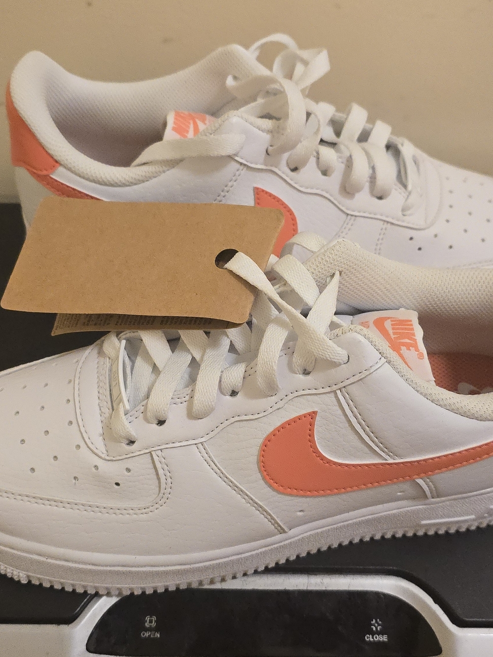 Nike White Low-Top Sneakers with Coral Swoosh